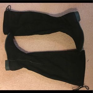 Over the knee boot with tie strings in the back